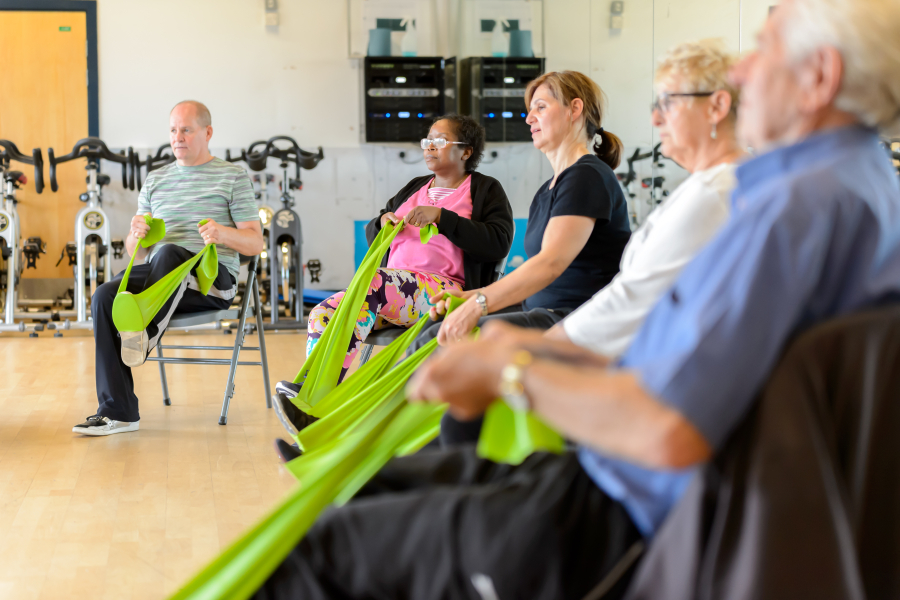 Seated exercise session with resistance bands for Forever Active